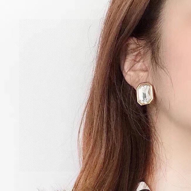 Martin Graham stud earrings in polished metal-tone – side detail