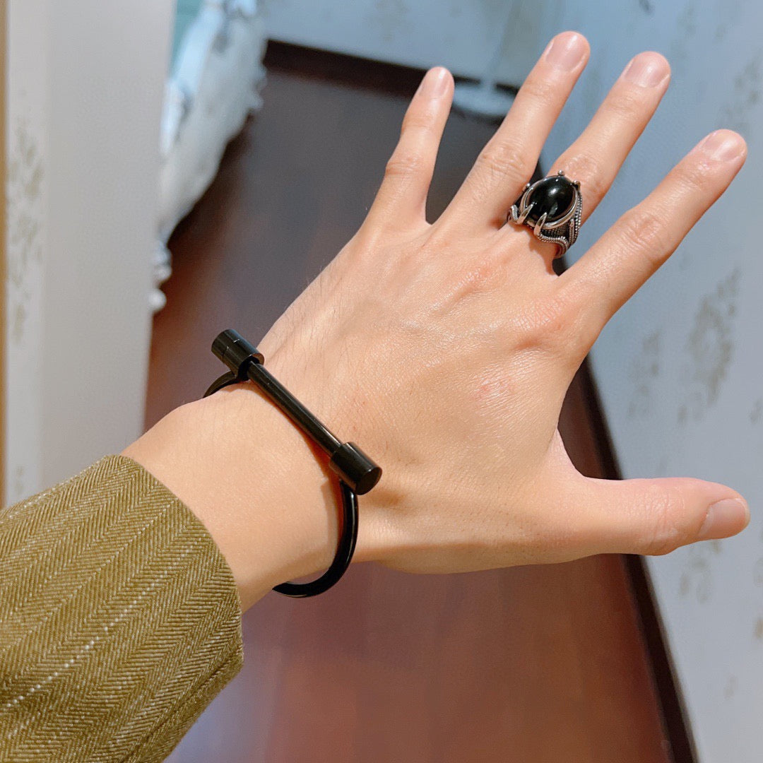Martin Graham bangle in polished metal-tone – detail view