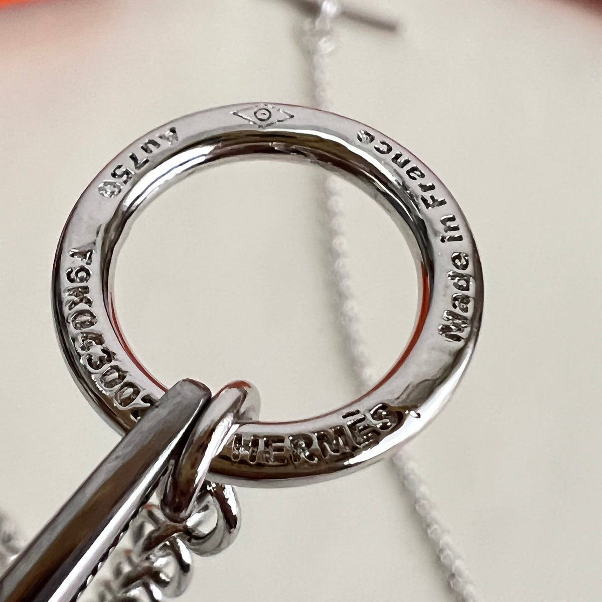 Martin Graham pendant necklace in polished metal-tone – detail view
