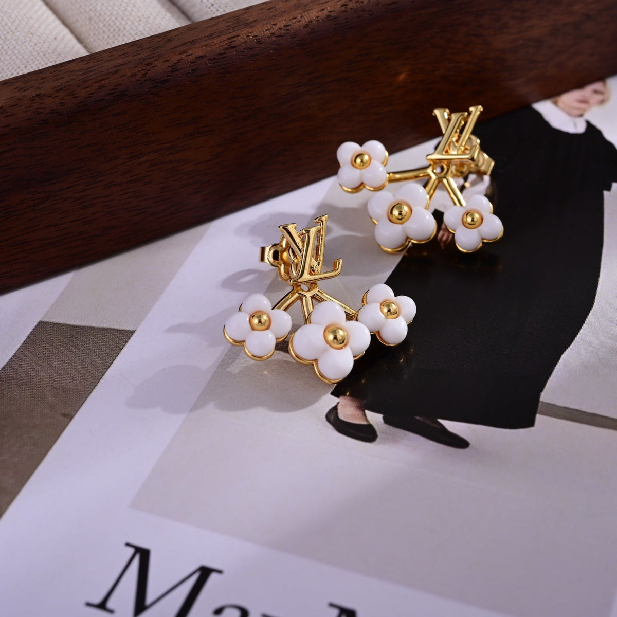 Martin Graham stud earrings in polished metal-tone – close-up detail