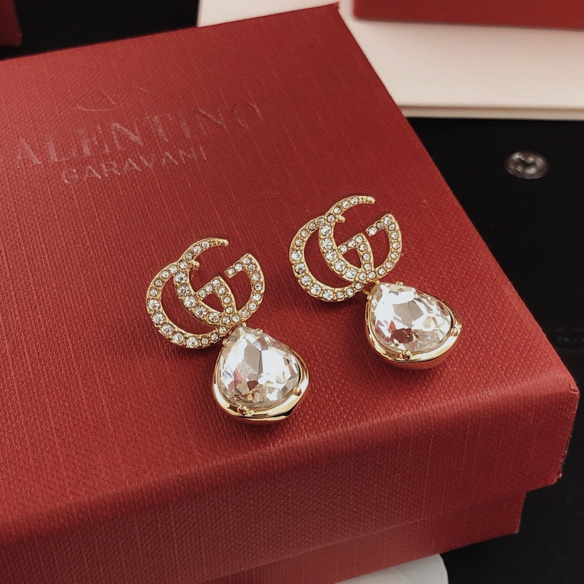 Martin Graham stud earrings in polished metal-tone – side detail