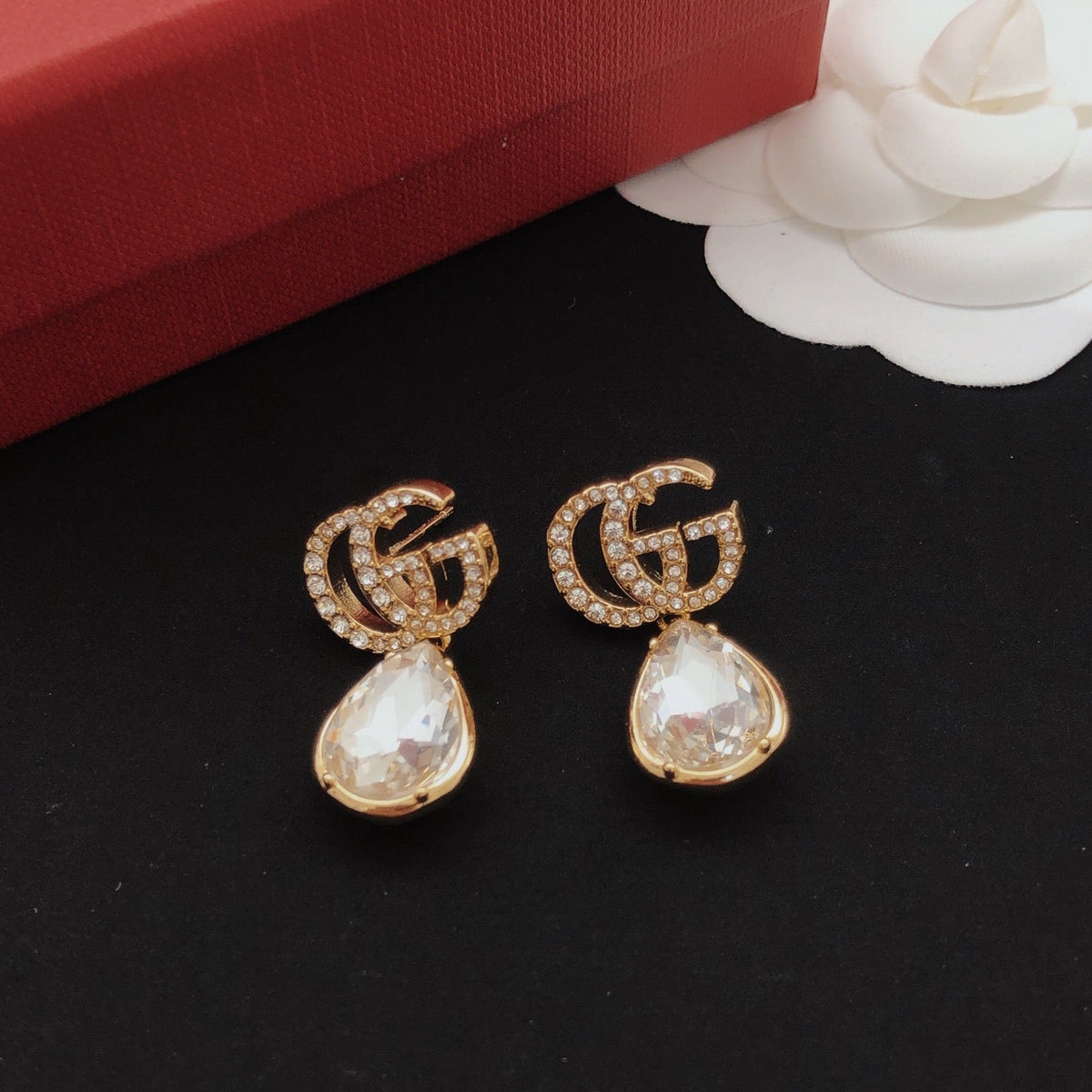 Martin Graham stud earrings in polished metal-tone – styled product view