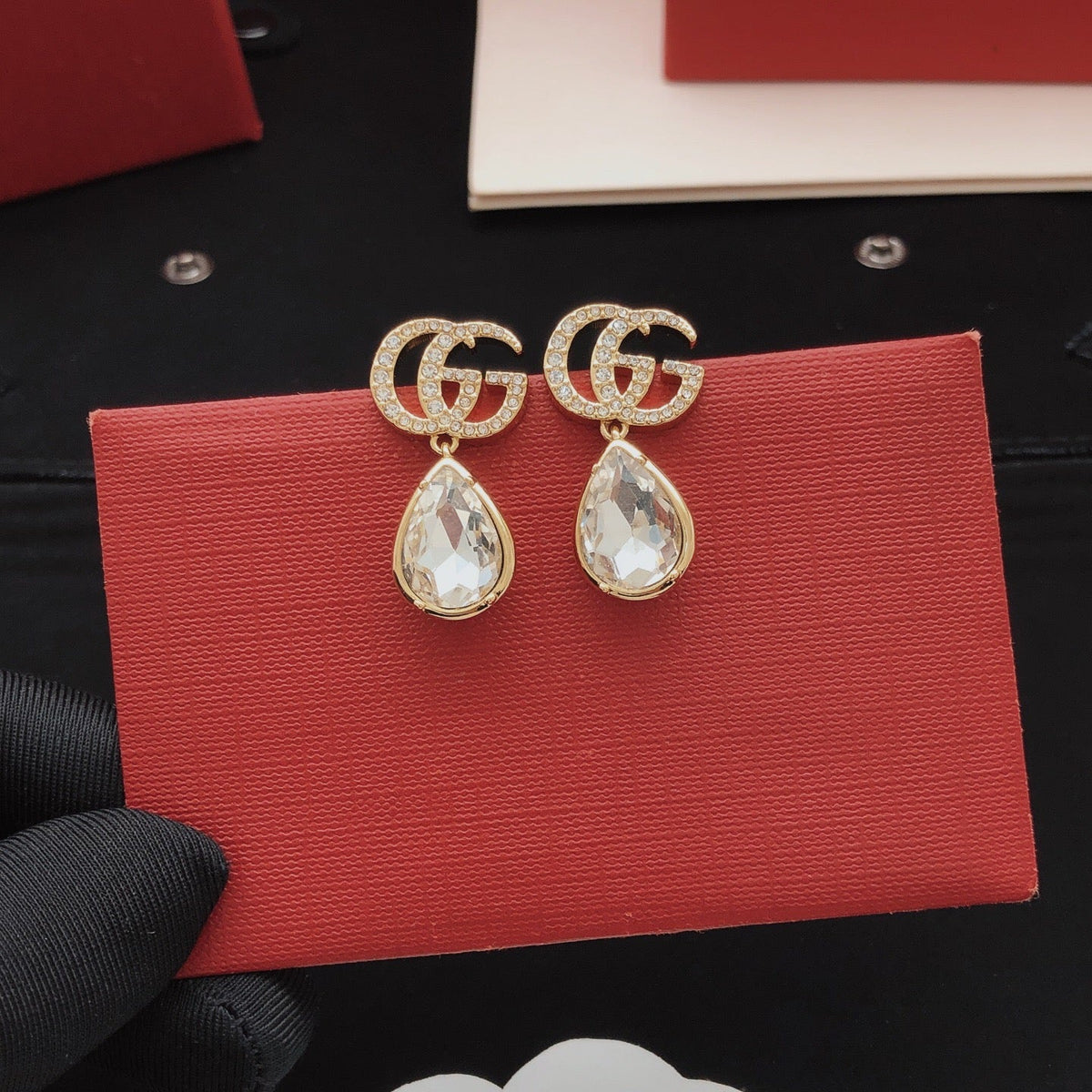 Martin Graham stud earrings in polished metal-tone – detail view