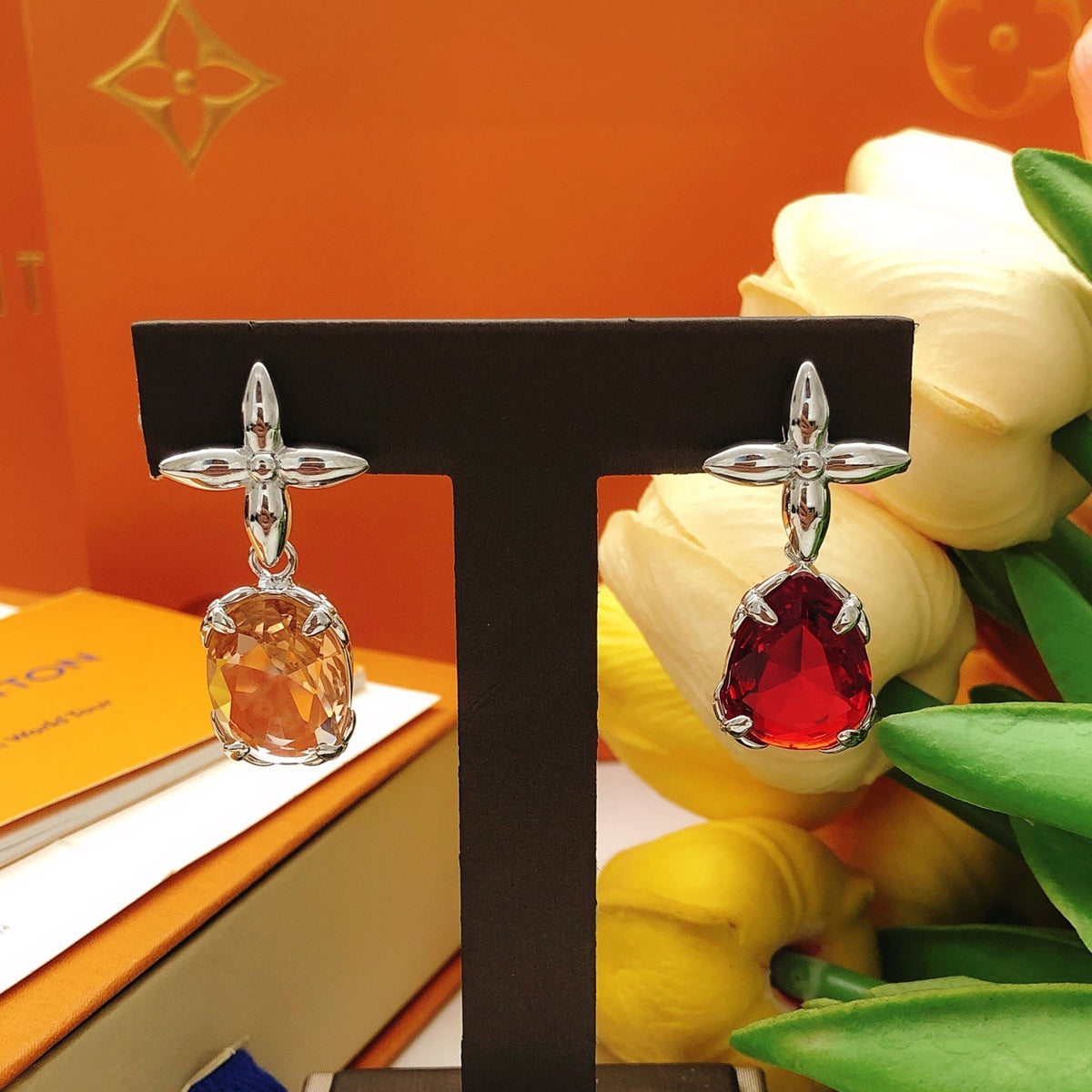 Martin Graham stud earrings in polished metal-tone – close-up detail