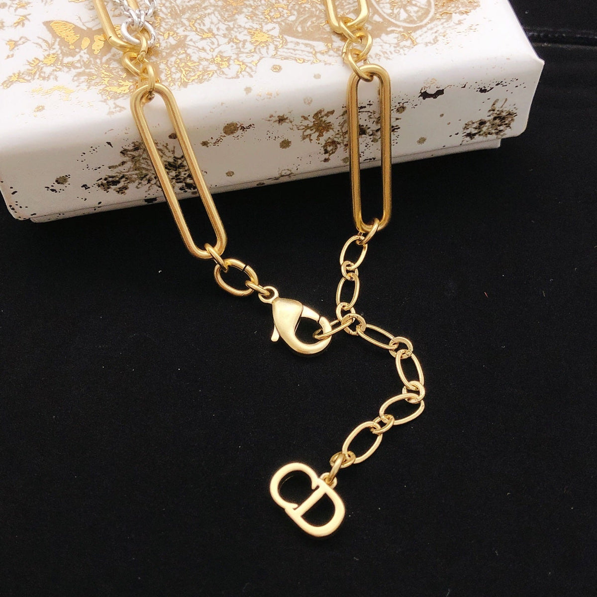 Martin Graham pendant necklace in polished metal-tone – front view