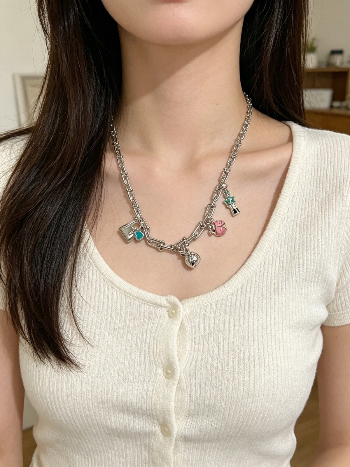 Martin Graham pendant necklace in polished metal-tone – side detail