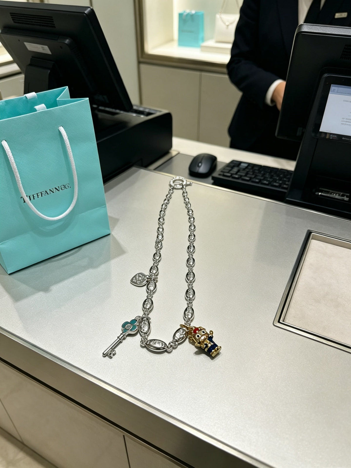 Martin Graham pendant necklace in polished metal-tone – close-up detail