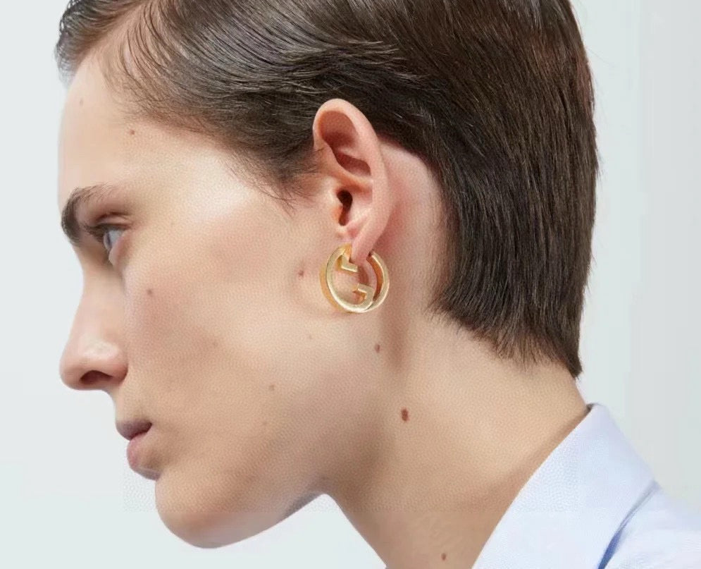 Martin Graham stud earrings in polished metal-tone – side detail
