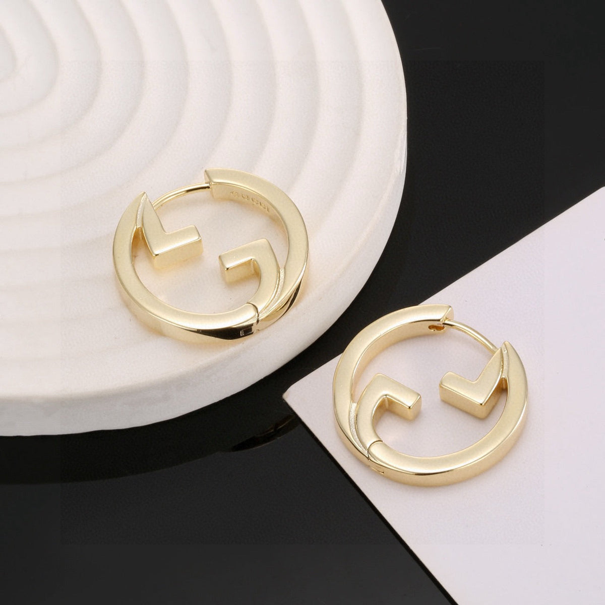 Martin Graham stud earrings in polished metal-tone – main product view