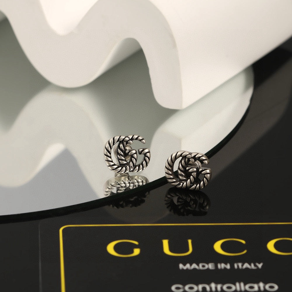 Martin Graham stud earrings in polished metal-tone – main product view