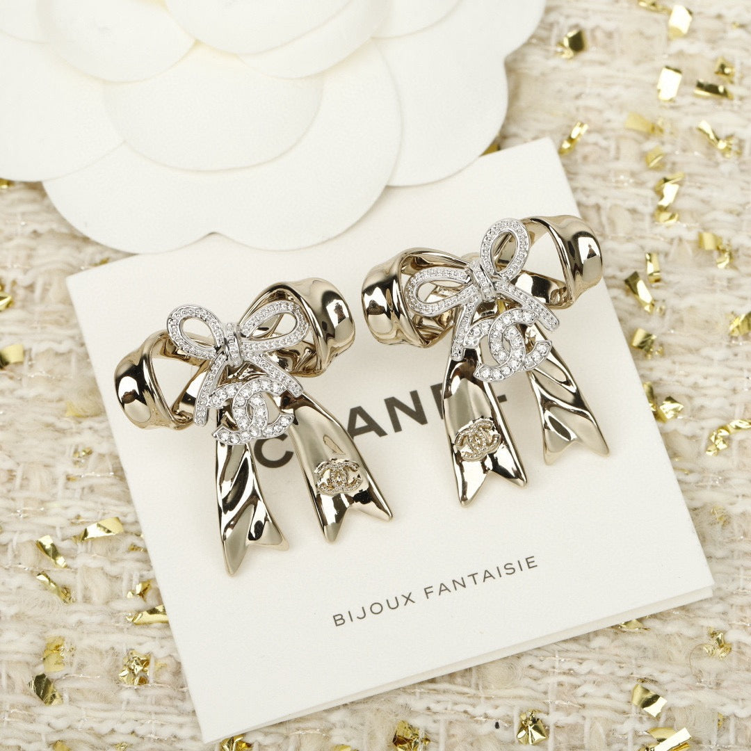 Martin Graham Bow stud earrings in polished metal-tone – side detail