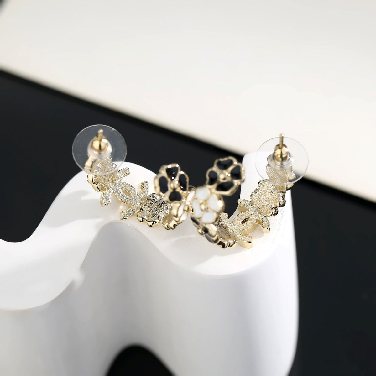 Martin Graham stud earrings in polished metal-tone – front product view