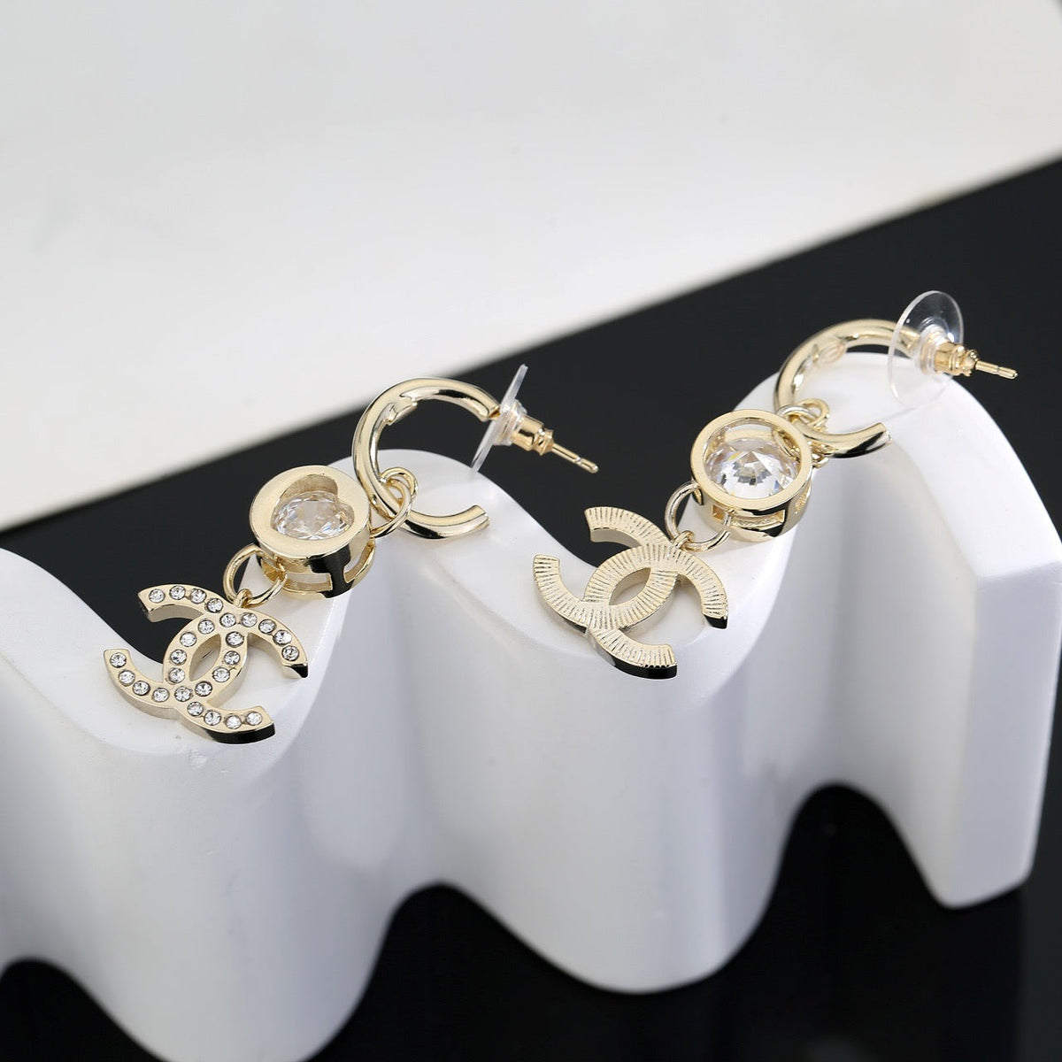 Martin Graham stud earrings in polished metal-tone – styled product view