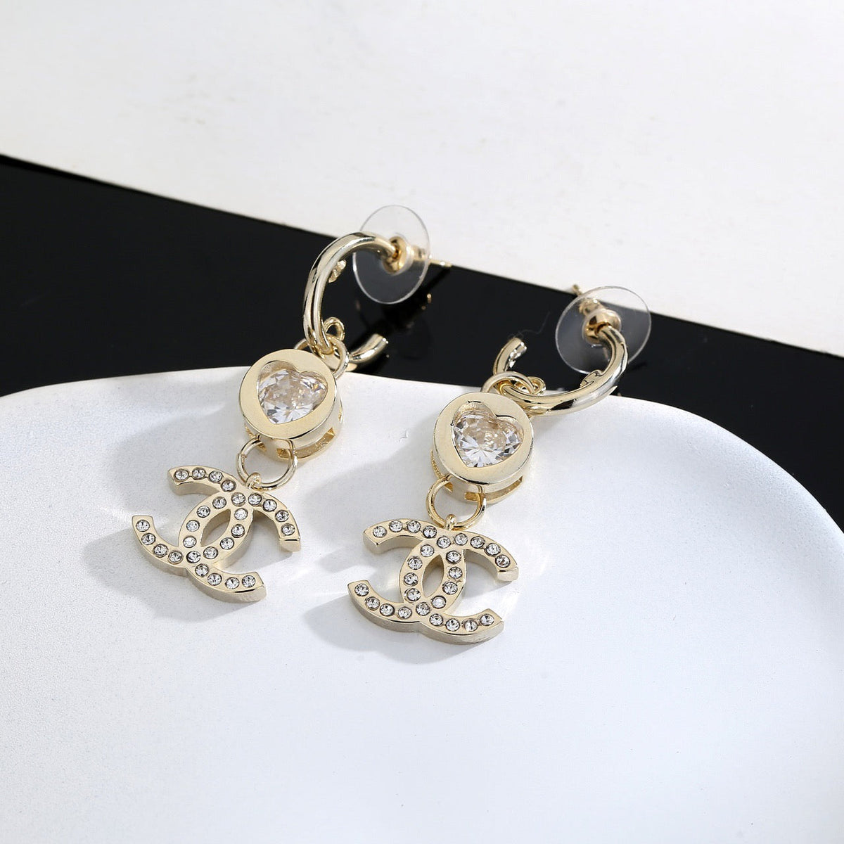 Martin Graham stud earrings in polished metal-tone – close-up detail