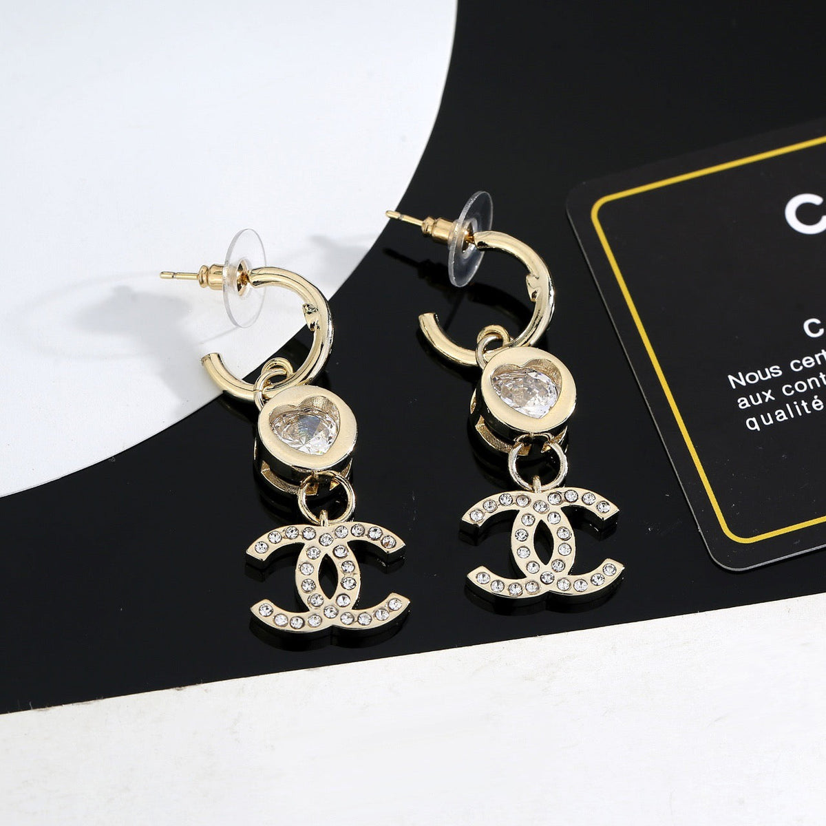 Martin Graham stud earrings in polished metal-tone – detail view