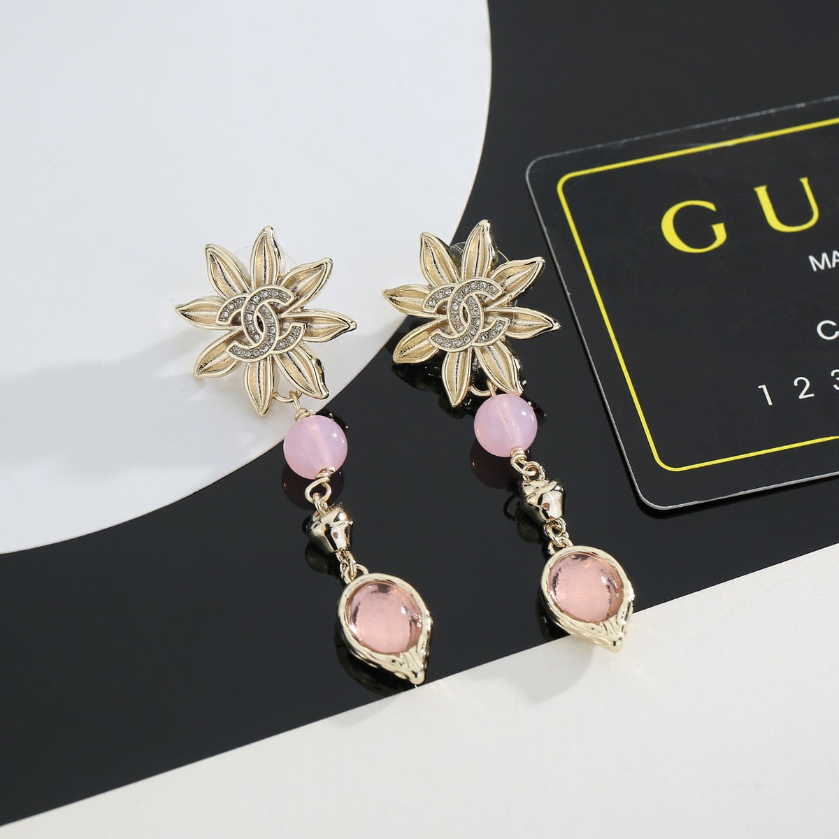 Martin Graham stud earrings in polished metal-tone – detail view