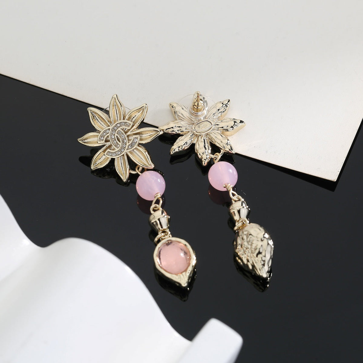 Martin Graham stud earrings in polished metal-tone – side detail