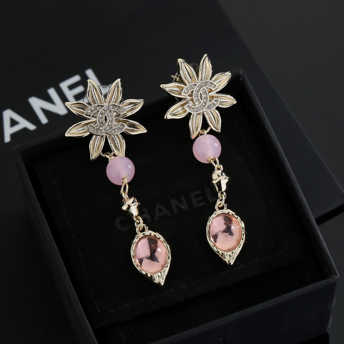 Martin Graham stud earrings in polished metal-tone – front product view