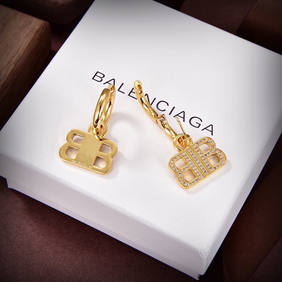 Martin Graham stud earrings in polished metal-tone – close-up detail