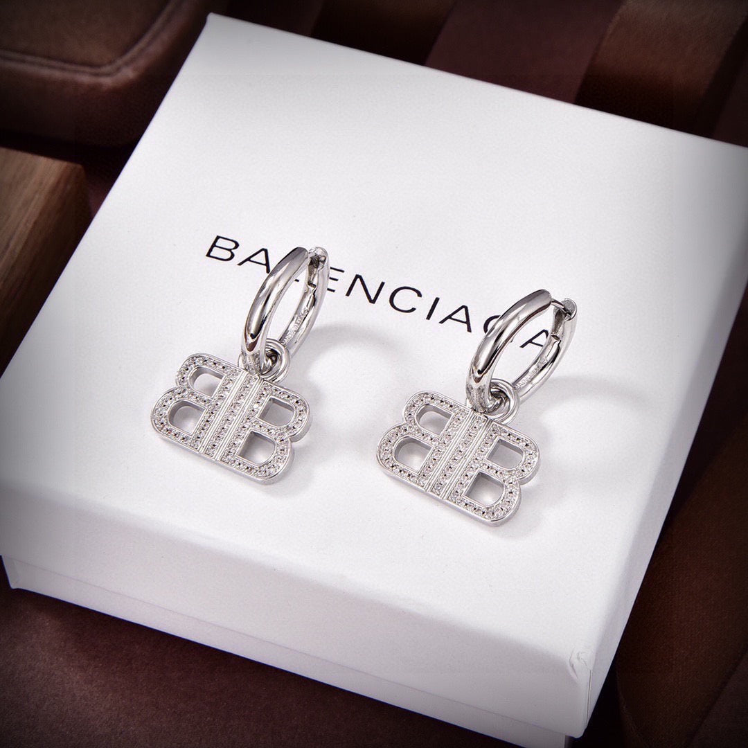 Martin Graham stud earrings in polished metal-tone – side detail