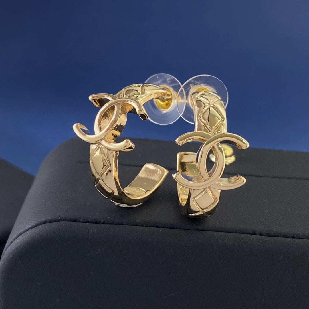Martin Graham stud earrings in polished metal-tone – front product view