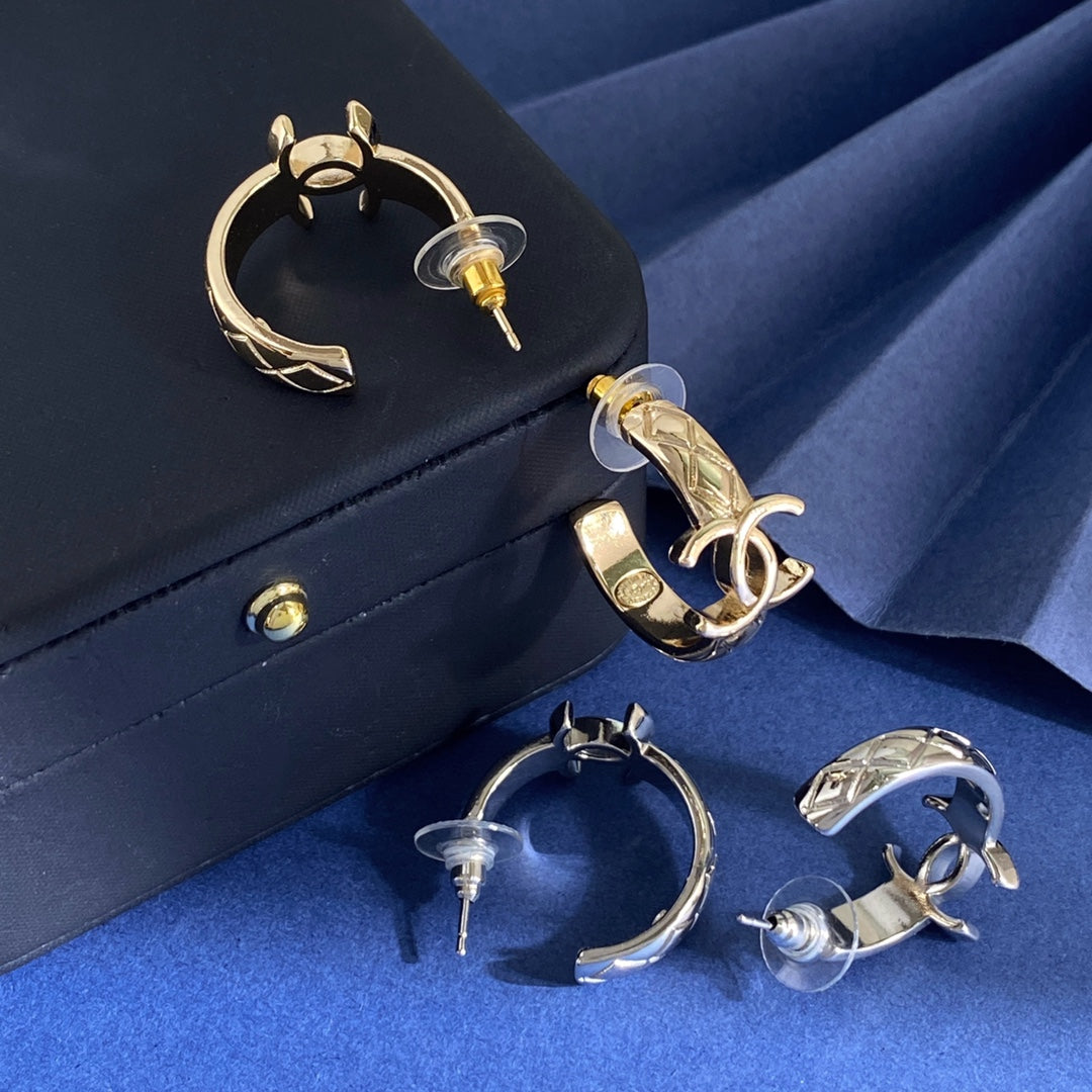 Martin Graham stud earrings in polished metal-tone – side detail