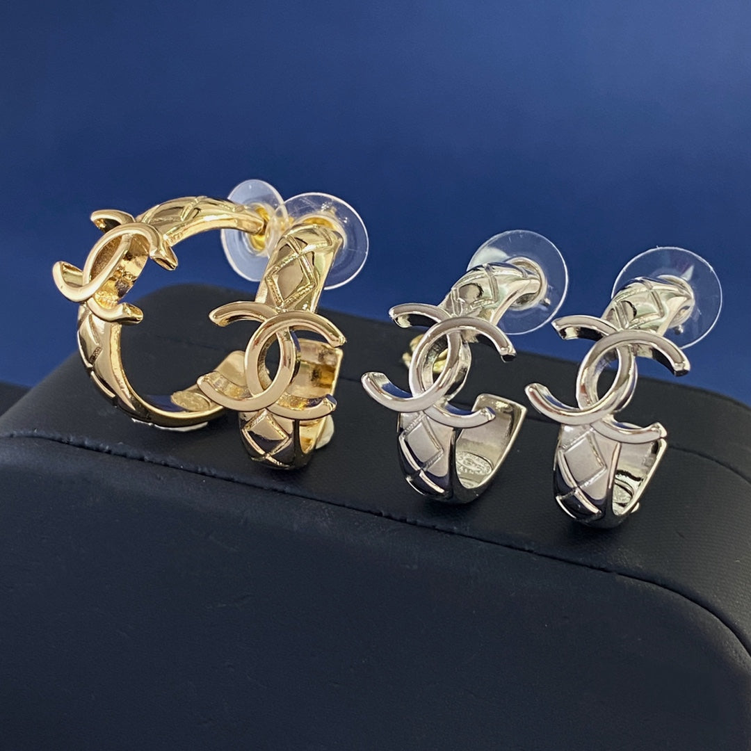 Martin Graham stud earrings in polished metal-tone – main product view