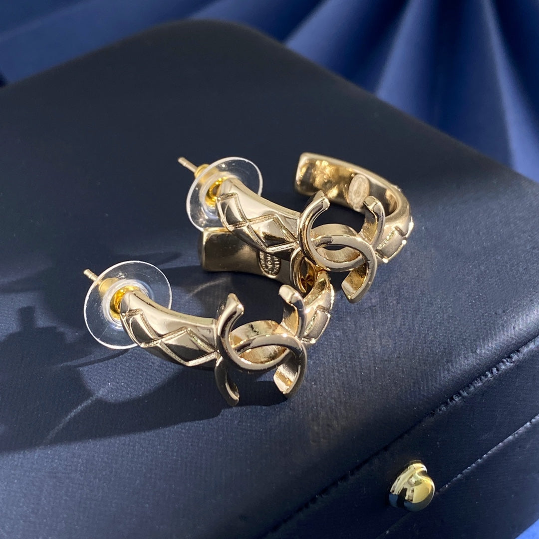Martin Graham stud earrings in polished metal-tone – main product view