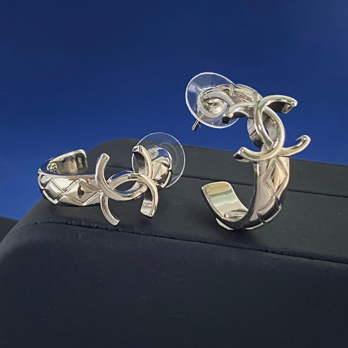 Martin Graham stud earrings in polished metal-tone – styled product view