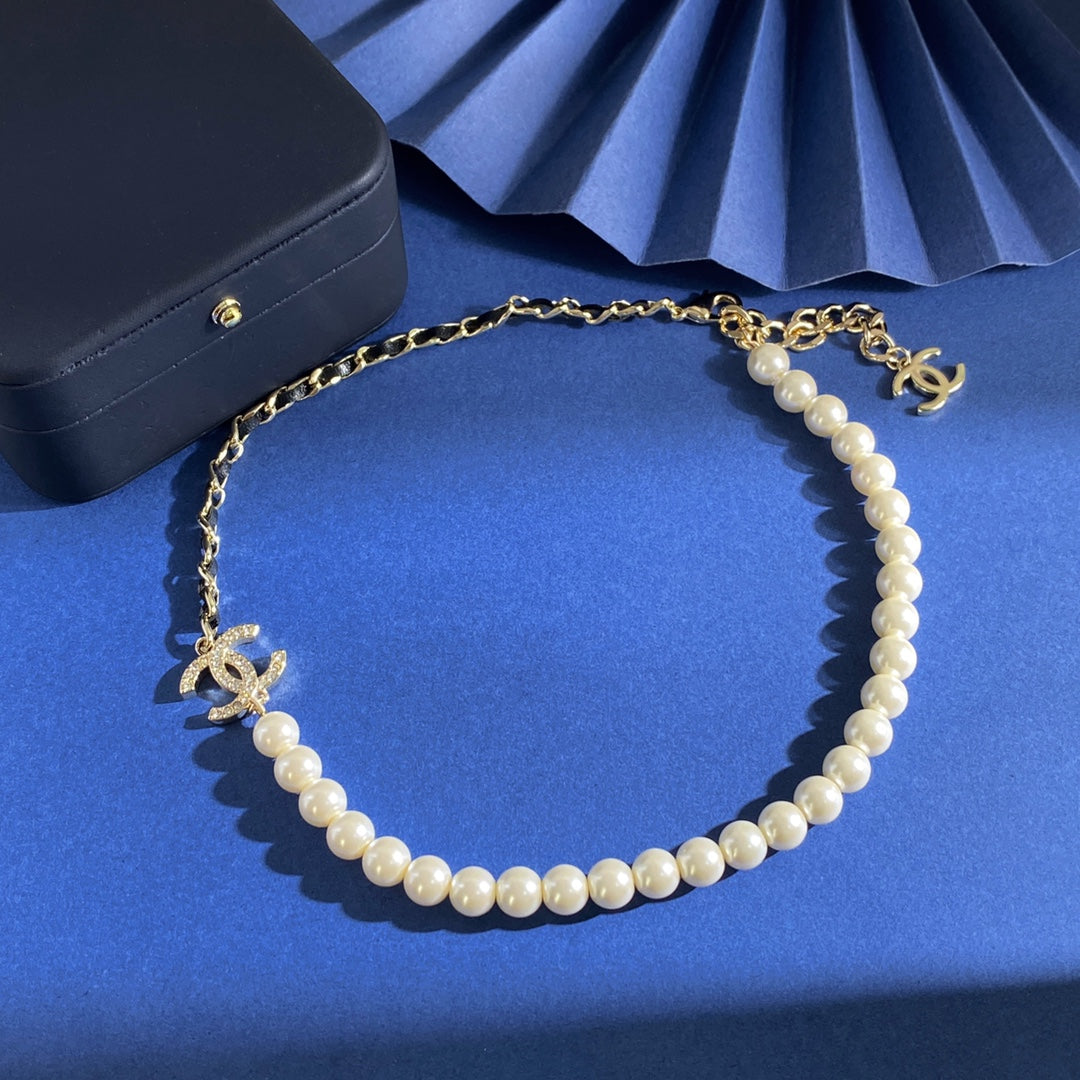 Martin Graham pendant necklace in polished metal-tone – close-up detail