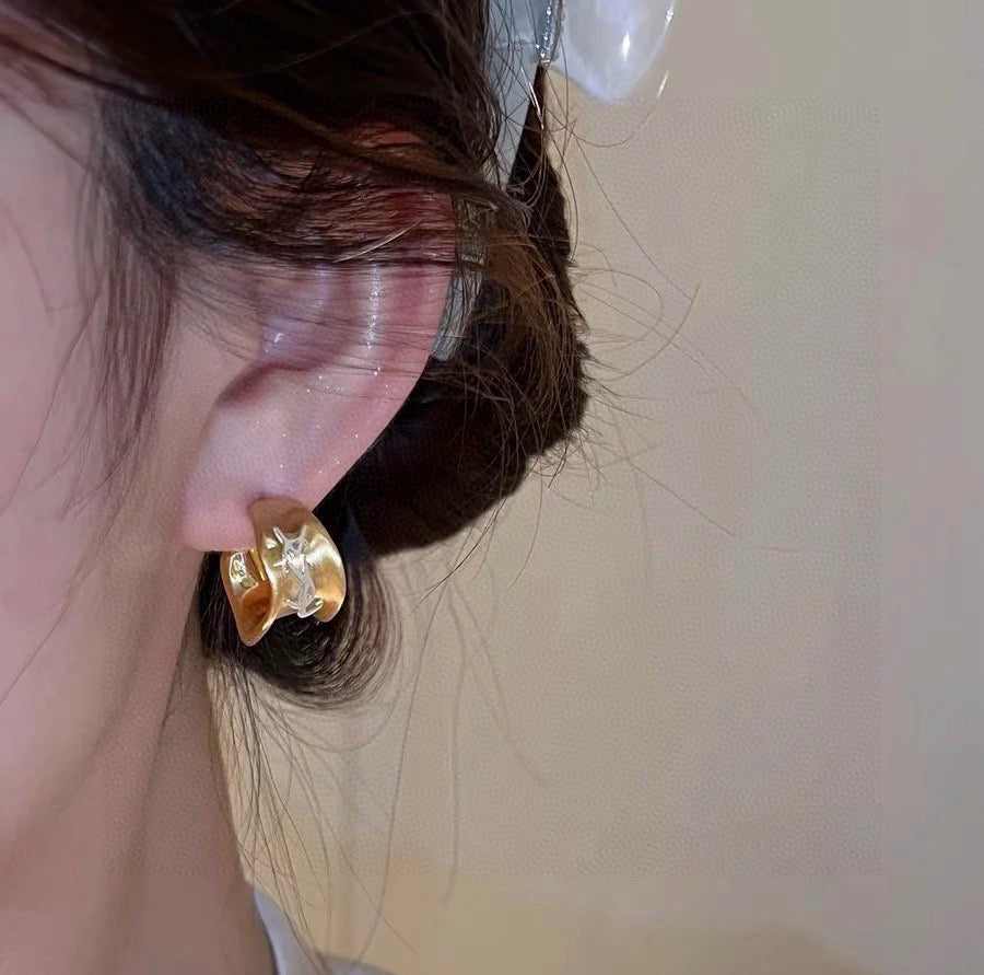 Martin Graham stud earrings in polished metal-tone – detail view