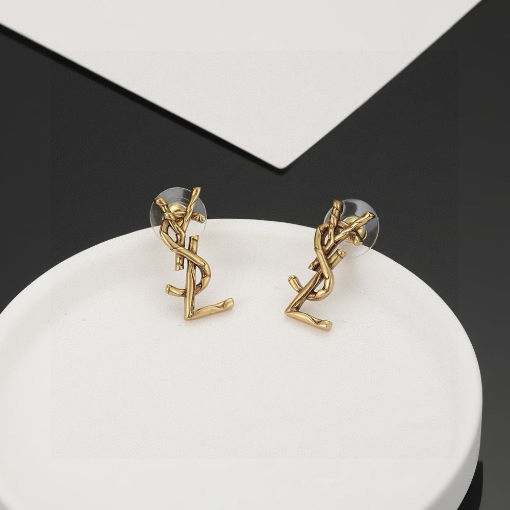 Martin Graham stud earrings in polished metal-tone – detail view