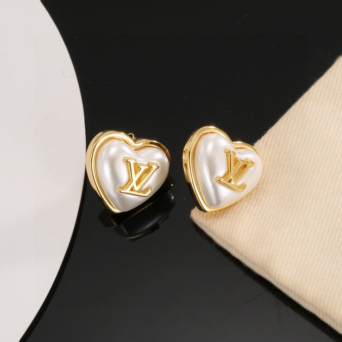 Martin Graham stud earrings in polished metal-tone – main product view