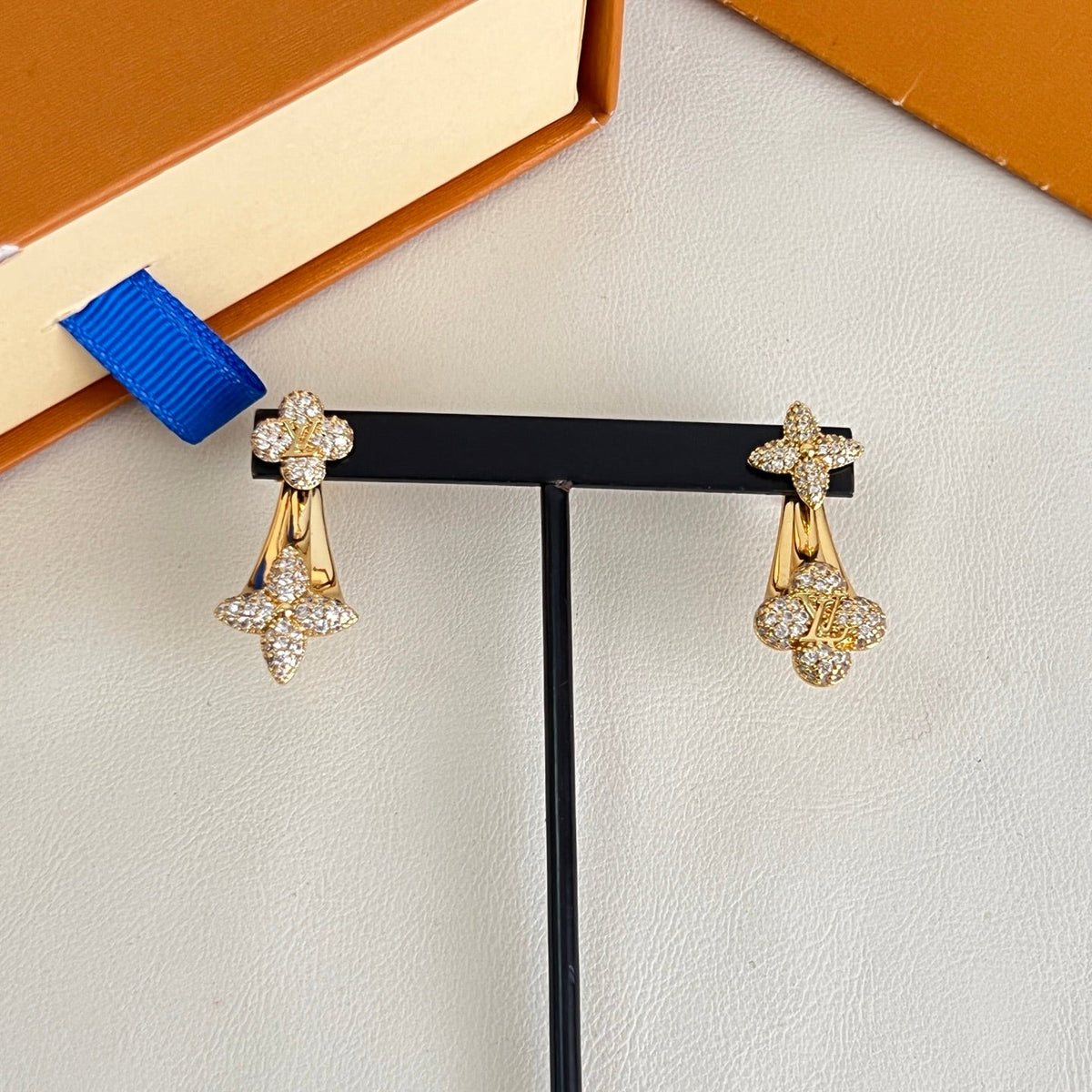 Martin Graham stud earrings in polished metal-tone – side detail