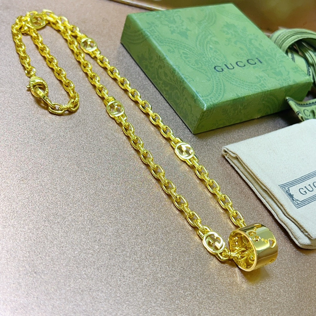 Martin Graham pendant necklace in polished metal-tone – side detail