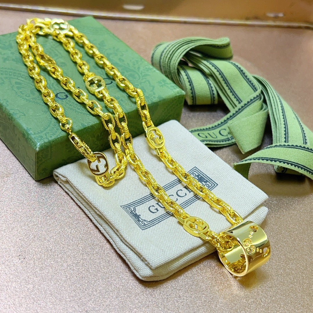Martin Graham pendant necklace in polished metal-tone – close-up detail
