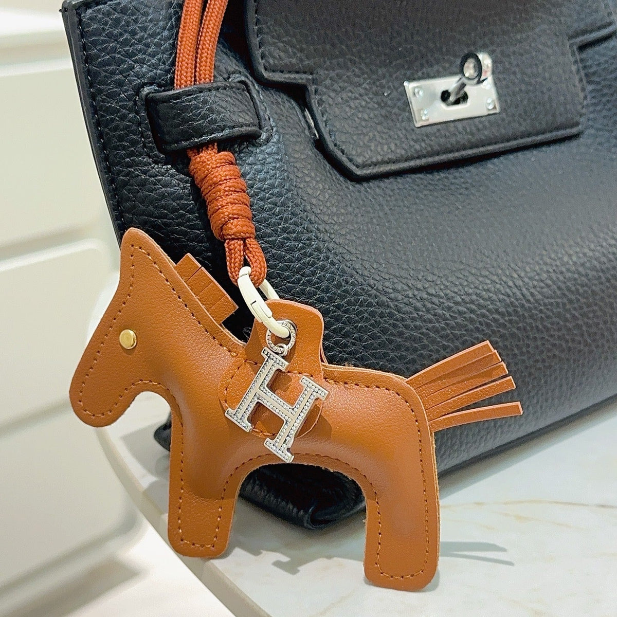 Martin Graham keychain in polished metal-tone – detail view