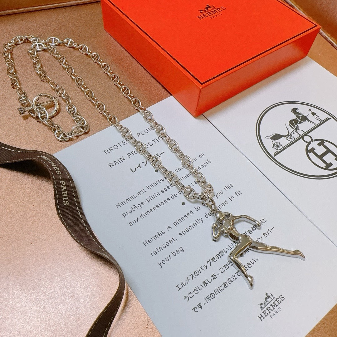 Martin Graham pendant necklace in polished metal-tone – side detail