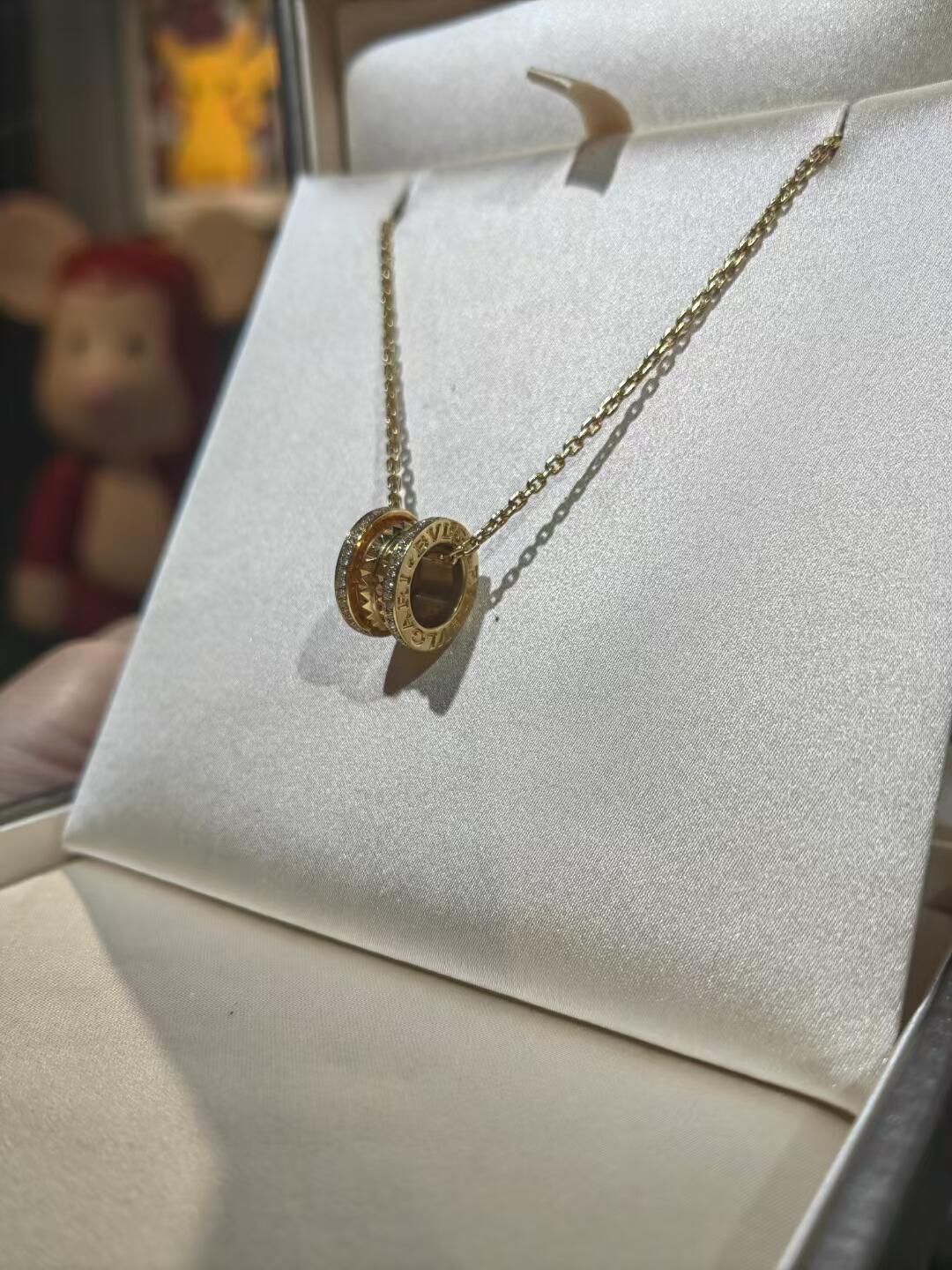 Martin Graham pendant necklace in polished metal-tone – detail view