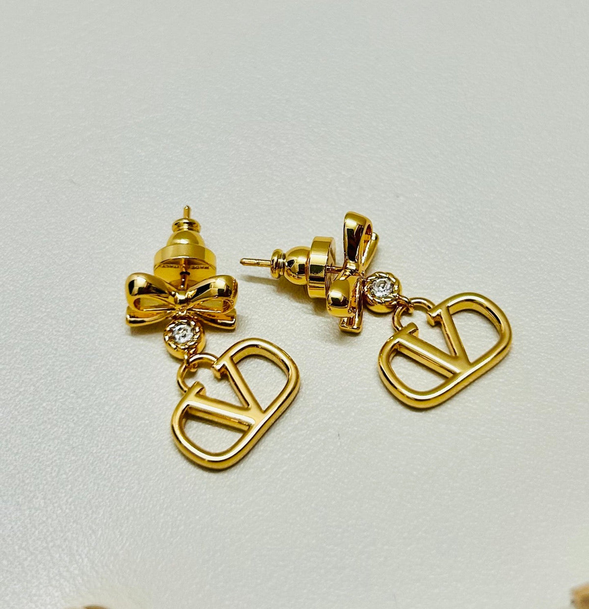 Martin Graham stud earrings in polished metal-tone – front view