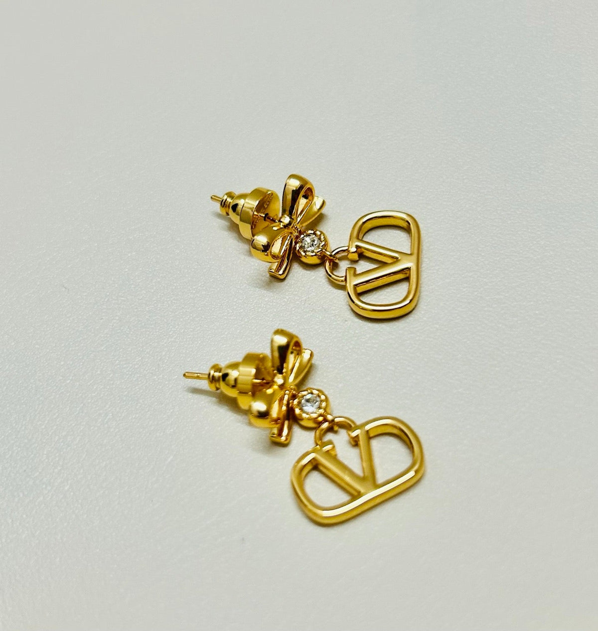 Martin Graham stud earrings in polished metal-tone – detail view