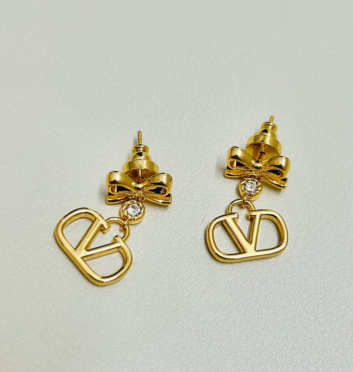 Martin Graham stud earrings in polished metal-tone