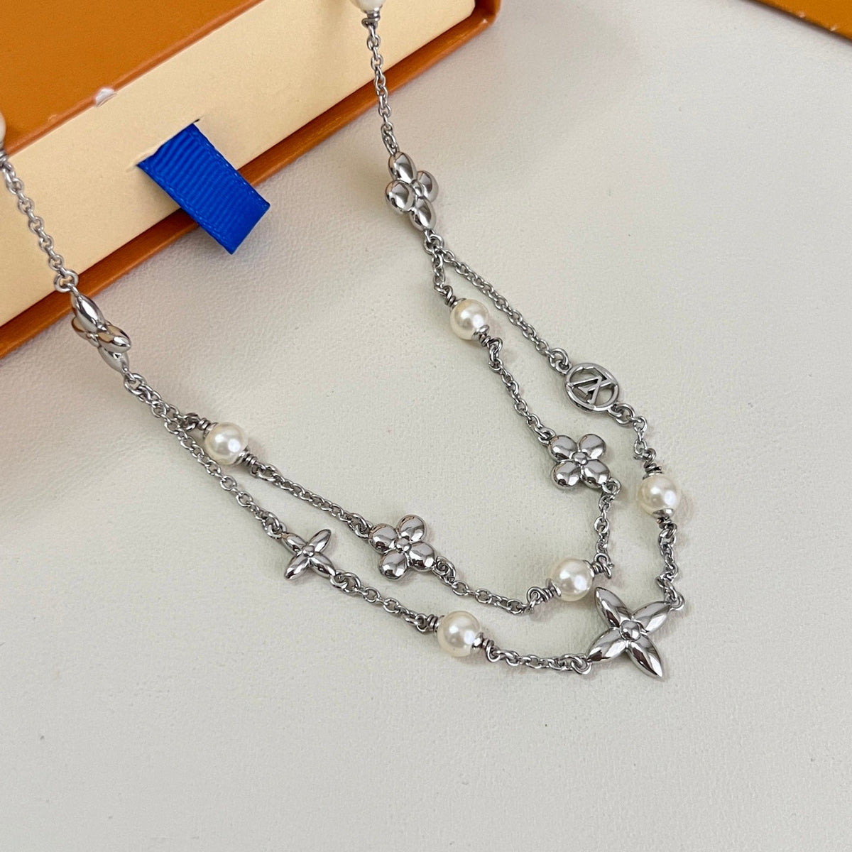 Martin Graham pendant necklace in polished metal-tone – detail view