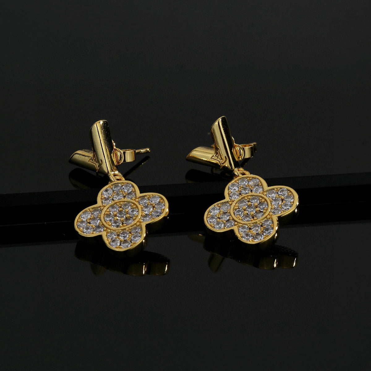 Martin Graham stud earrings in polished metal-tone – front product view