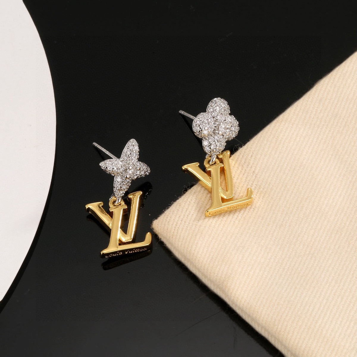 Martin Graham stud earrings in polished metal-tone – front product view