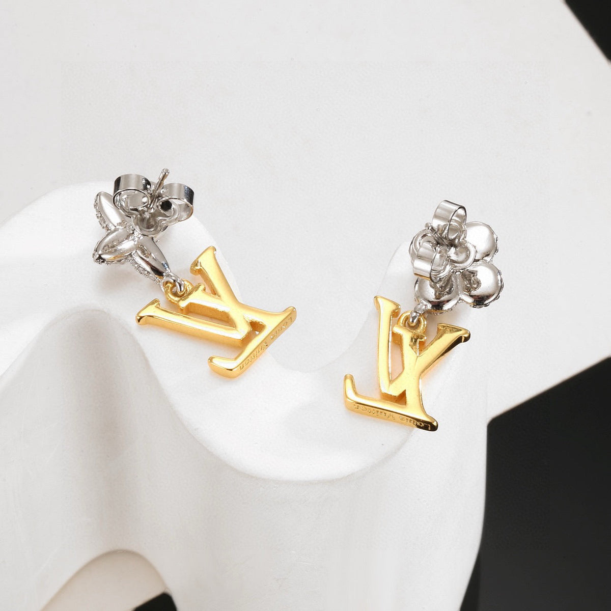 Martin Graham stud earrings in polished metal-tone – side detail