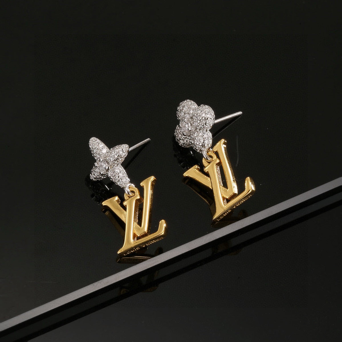 Martin Graham stud earrings in polished metal-tone – detail view