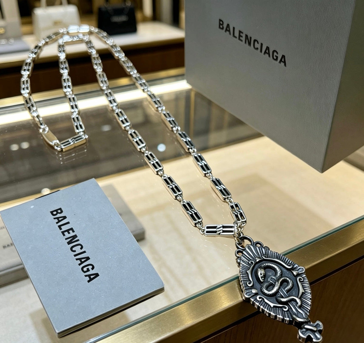 Martin Graham pendant necklace in polished metal-tone – front product view