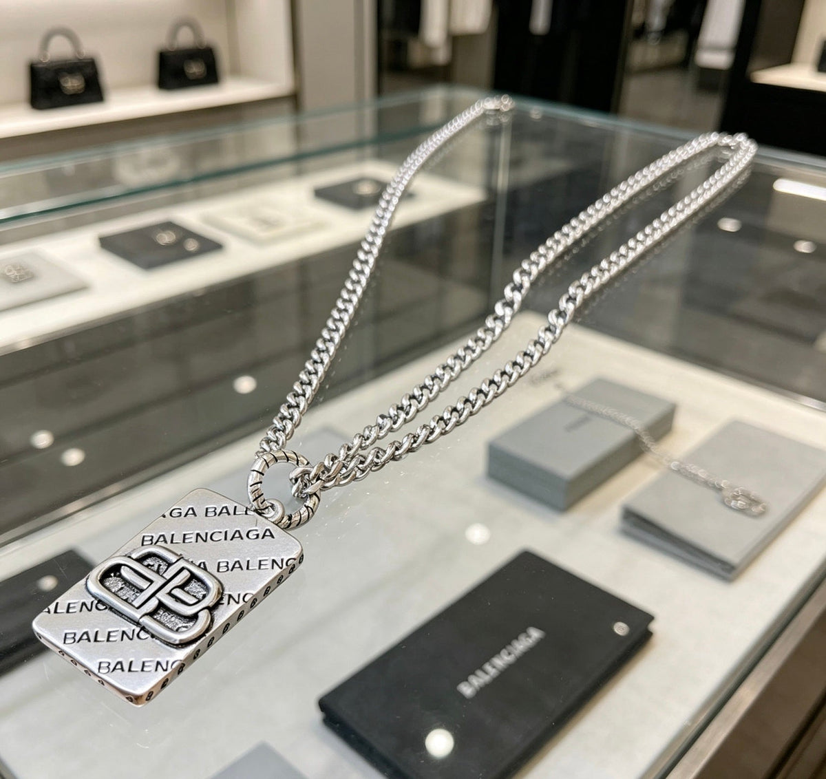 Martin Graham pendant necklace in polished metal-tone – front product view