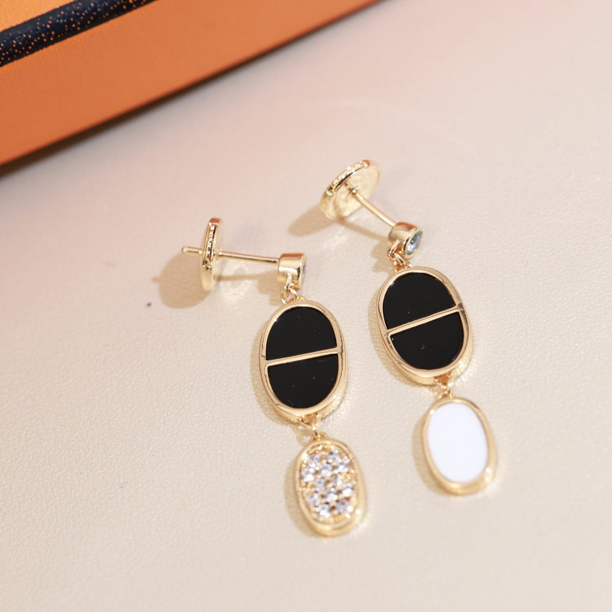 Martin Graham stud earrings in polished metal-tone – main product view